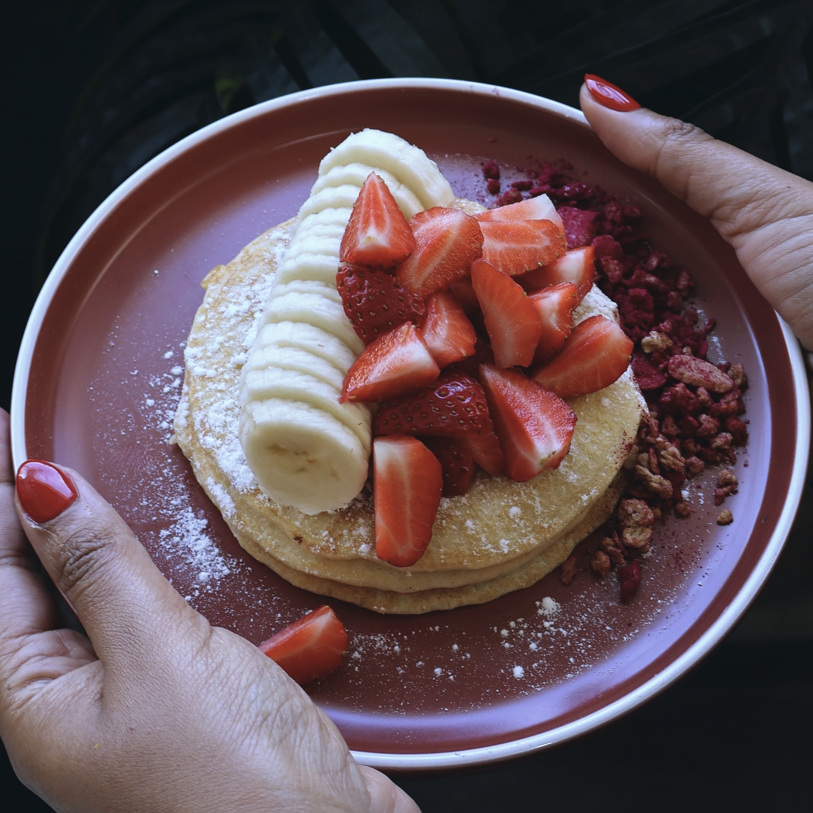 Three homemade pancakes, banana, strawberry, homemade granola